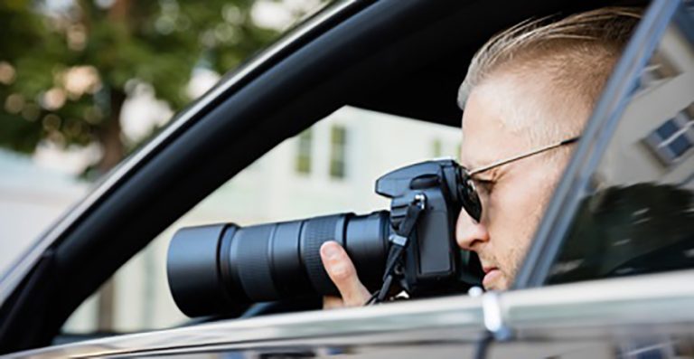 Man Photographing With SLR Camera